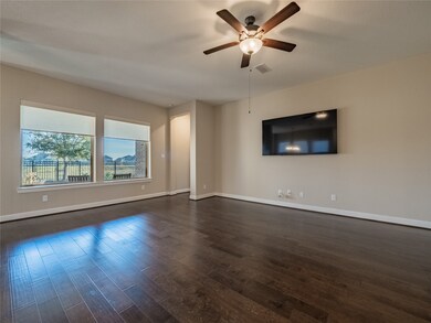 family room with oversized windows facing the wate