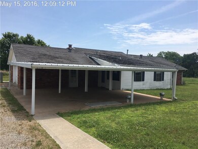 Back covered patio, carport, and room addition whi