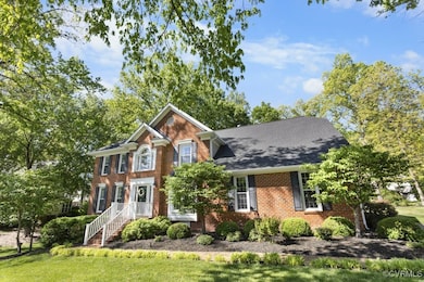 View of front of house featuring brick siding and