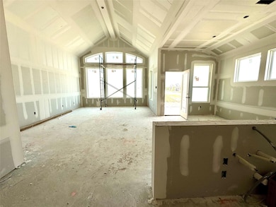 Miscellaneous room featuring vaulted ceiling