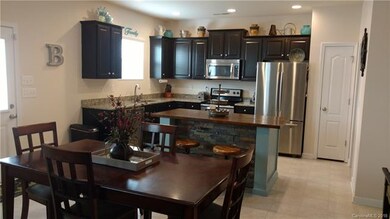 Another View of Kitchen and Dining area. Pantry cl
