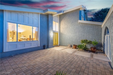 Twilight View of Doorway to property in courtyard