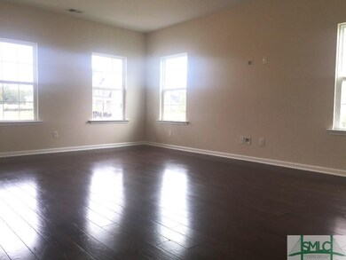 This spacious family room flows into the kitchen a