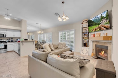 Living area with light tile patterned floors, visi