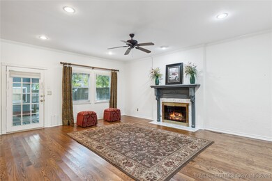 Spacious Great Room with gas logs, open to dining