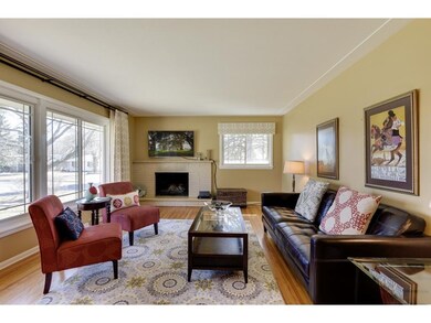 The living room has one of the two wood-burning fi