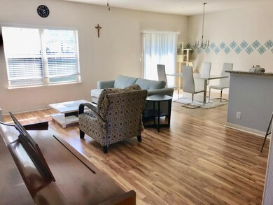 Living area with baseboards, a healthy amount of 