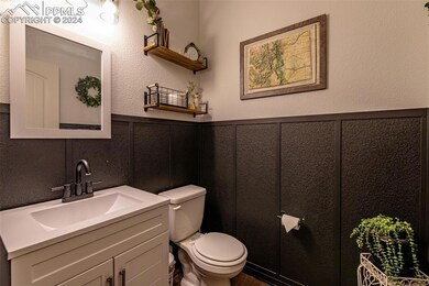 Updated Bathroom featuring toilet and vanity