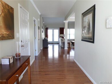 Beautiful spacious foyer with hardwood floors and 