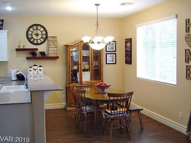 Convenient dining area off kitchen. Wood look tile