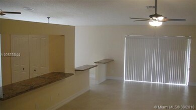 FAMILY ROOM w/ SLIDERS TO POOL AREA