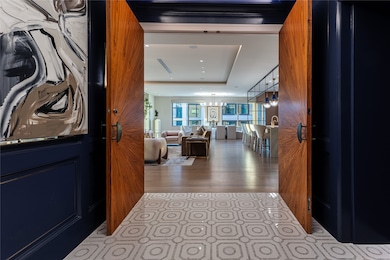 Direct access elevator opens to private vestibule with inlaid marble floors & double wood doors.