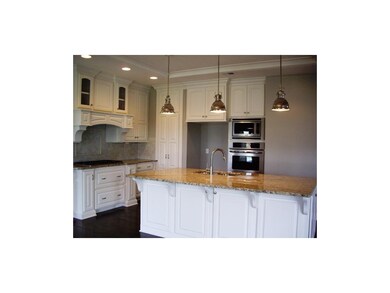 Well appointed kitchen has huge island an hidden p
