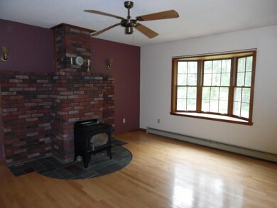 Living room with hard wood floors,...