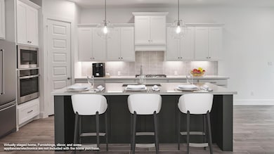 Kitchen with stainless steel appliances, tasteful