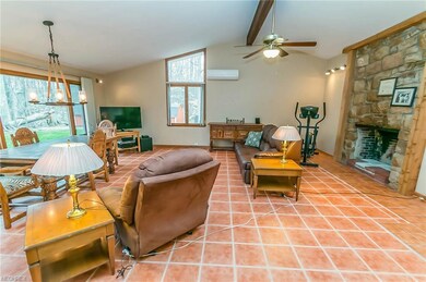 Great Room with Stone Woodburning Fireplace