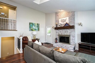 Gas fireplace w/ barn wood mantle.