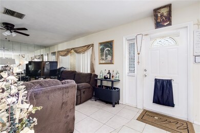 Living area featuring light tile patterned floors
