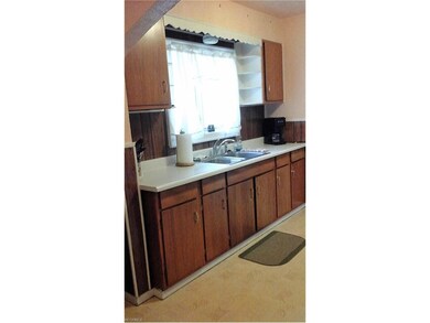 Kitchen has  a well placed window over the sink to
