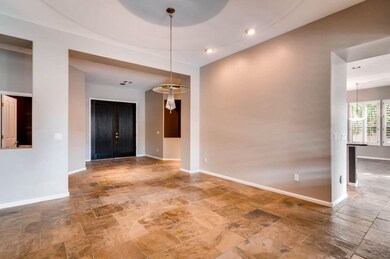 Formal dining area features modern light