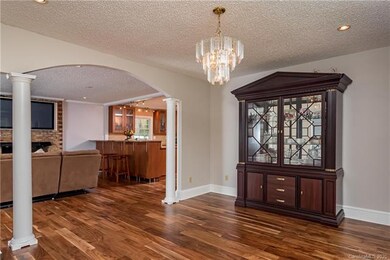 Entry view of Dining room arches, looking into living room and kitchen