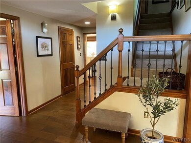 Engineered Hardwood thoughout Foyer, Den and Kitch