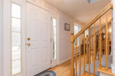 The front door welcomes guests with...