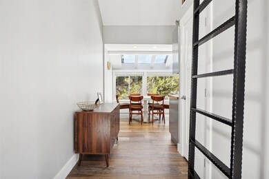 Corridor with baseboards and wood finished floors