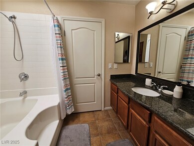 Bathroom with a textured wall, shower / bath combi