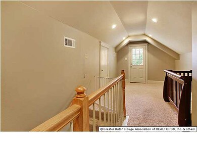 Upstairs den area with door to private balcony.