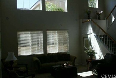 Formal living room with lots of natural light.