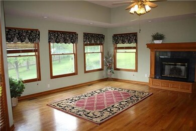 COZY hearth room overlooks large treed lot and wal