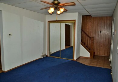 Living room with large coat closet.