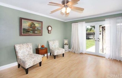 Family room area of kitchen with newer glass French doors leading to back yard.