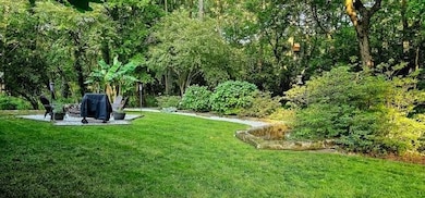 View of green lawn in this large area that is terr