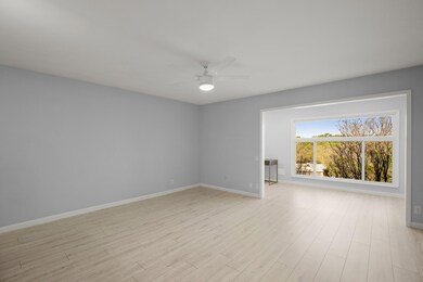 Empty room with a ceiling fan, baseboards, and li
