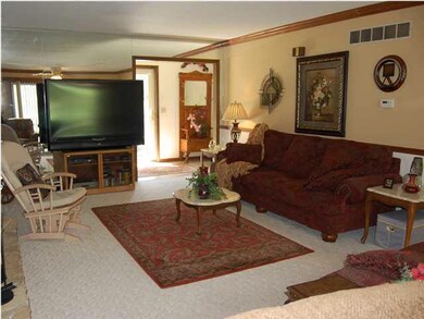 Another view of the large living room to the entry
