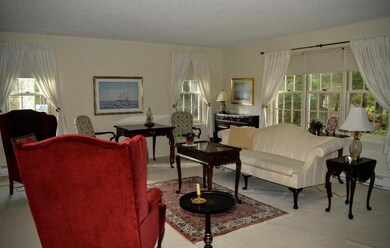 The living room has large windows...