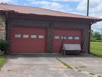 Garage featuring concrete driveway