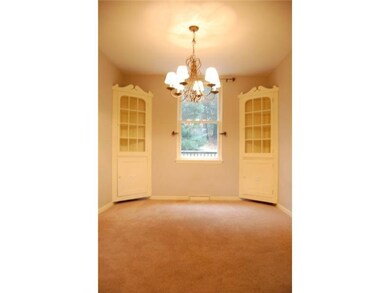 Dining Room. Built in corner cabinets add to the c