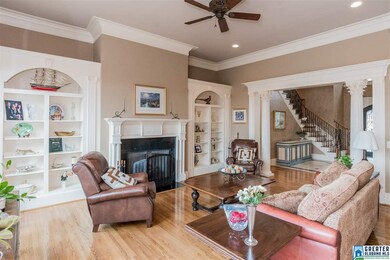 Greatroom offers a cozy fireplace and built-in she