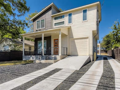 Traditional-style house featuring concrete drivew