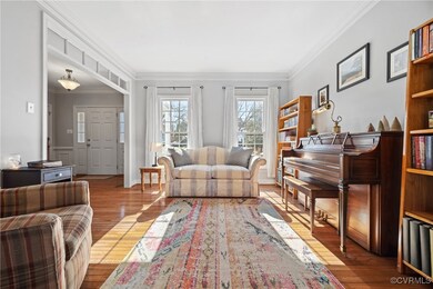 Living area with ornamental molding and wood finis