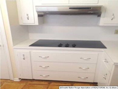 Flat top stove in kitchen