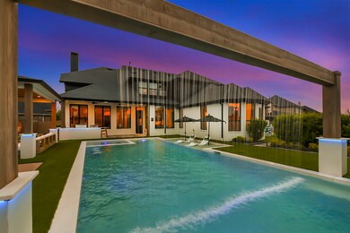 The large pool and spa at 2523 Haven Hill boast a captivating aerating waterfall feature. Not only does this add visual appeal and a sense of tranquility to the surroundings, but it also serves a practical purpose. During the hot summer months, the waterfall helps regulate the pool temperature, keeping it refreshingly cool for a soothing dip. It's a refreshing and rejuvenating feature that enhances the overall enjoyment of the outdoor space.