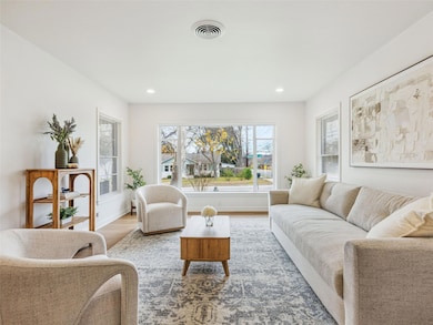Living room featuring wood finished floors and recessed lighting