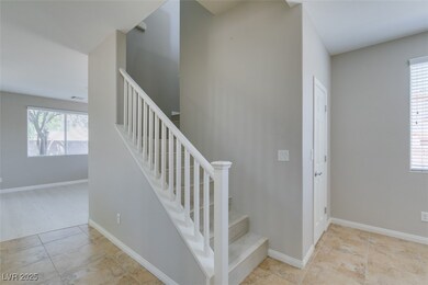 Stairway with tile patterned flooring and baseboar