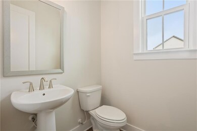 Bathroom with baseboards and toilet