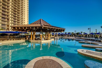 Community pool featuring a hot tub and a gazebo
