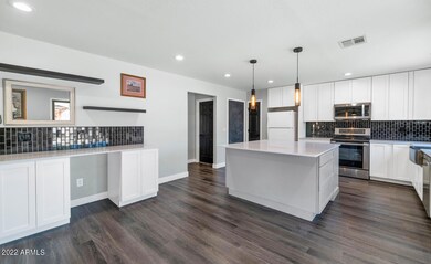 9850 W Lone Cactus Dr-large-010-008-9850